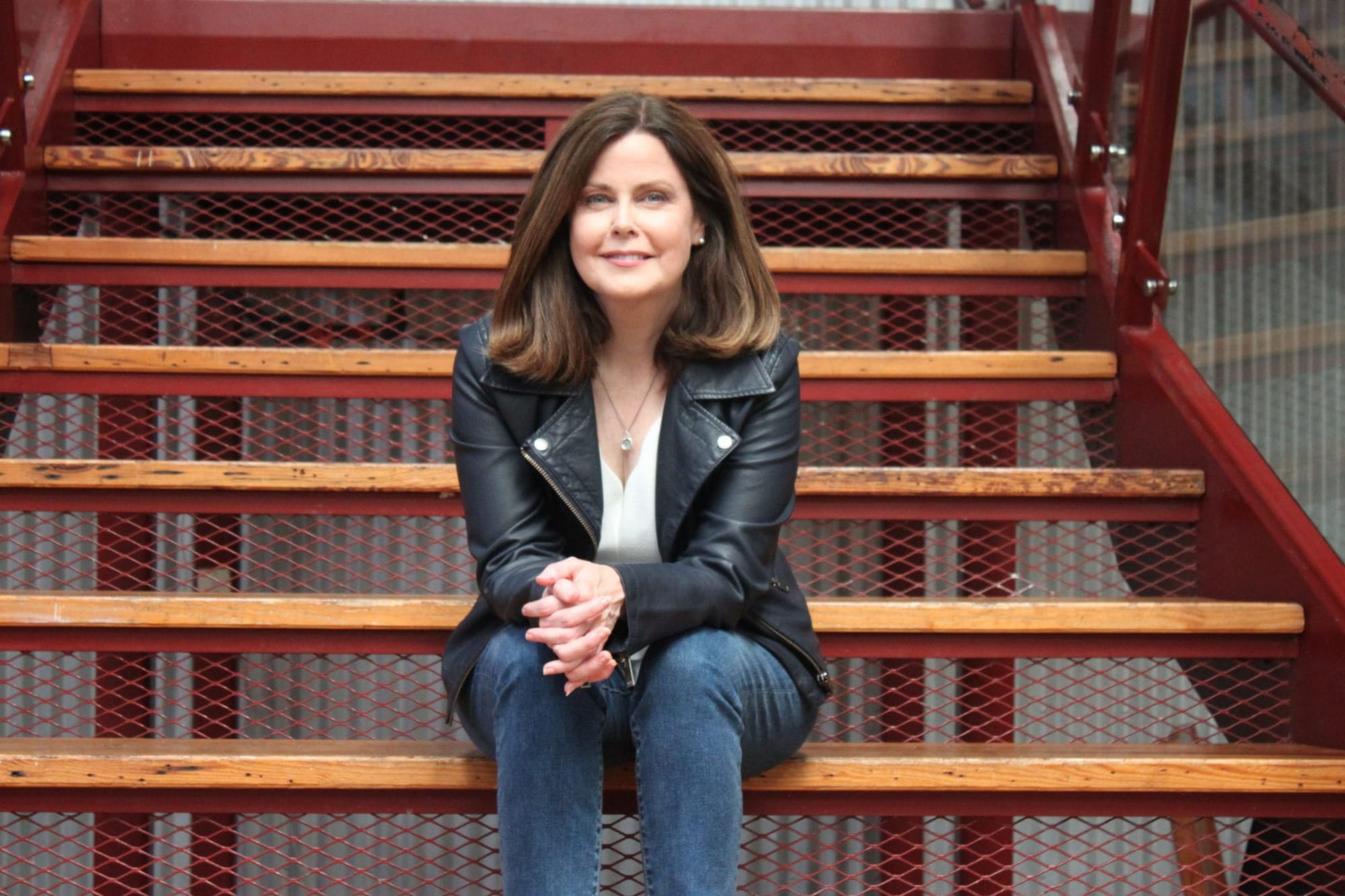 Sitting On Red Staircase